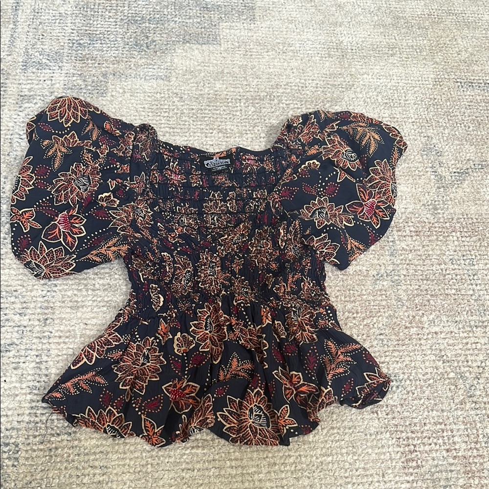 Angie Black and Orange Smocked Peplum Blouse